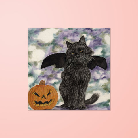 Halloween themed blank greeting card of a black cat wearing bat wings sat next to a pumpkin. Reproduction of an original Painting by Irish Wildlife Artist Jessica Ivy  Edit alt text