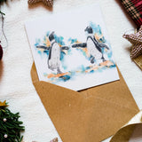 Dancing penguins Christmas card by Irish Wildlife artist Jessica Ivy